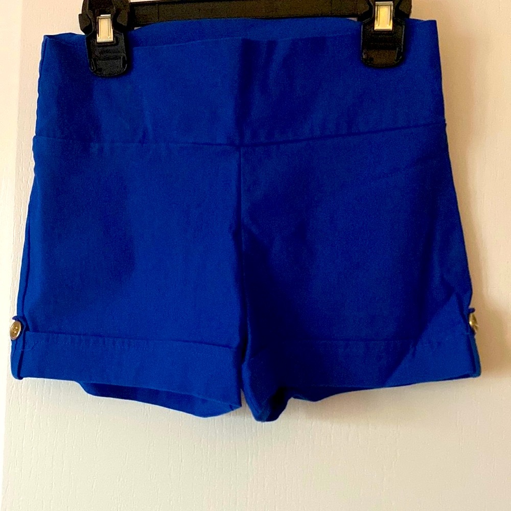 Cute blue short. with button design on each side.